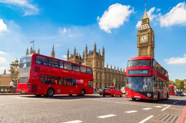 Big Ben and the hardly less famous red double-decker buses in London